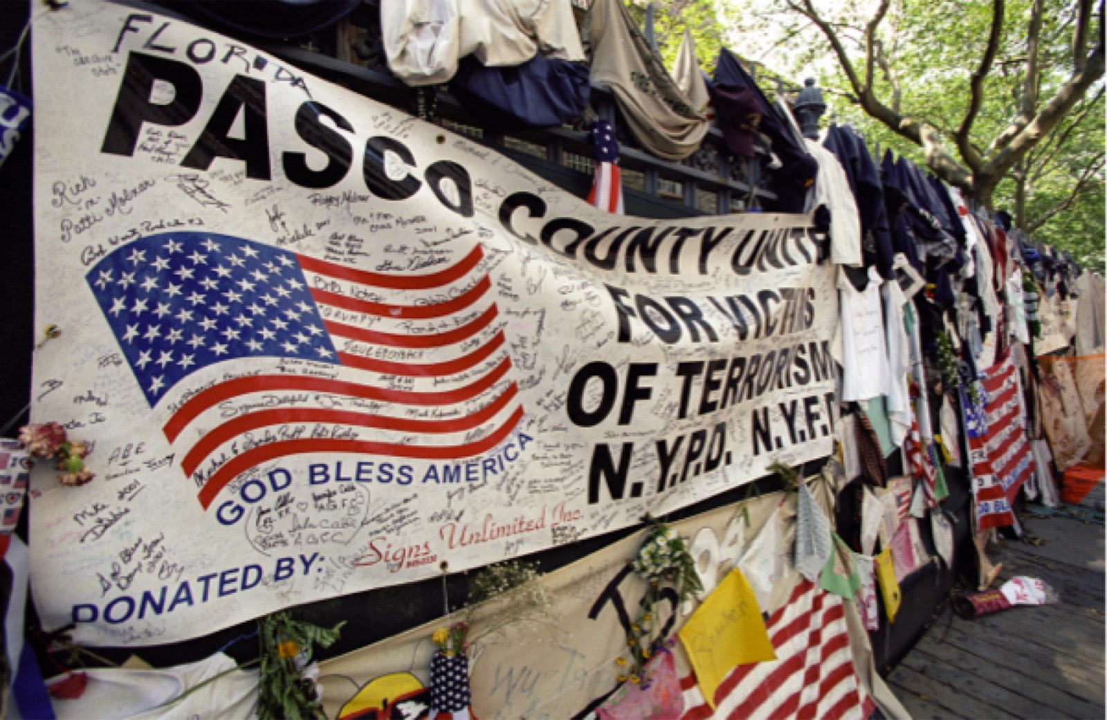 9/11 memorial with signatures and flags